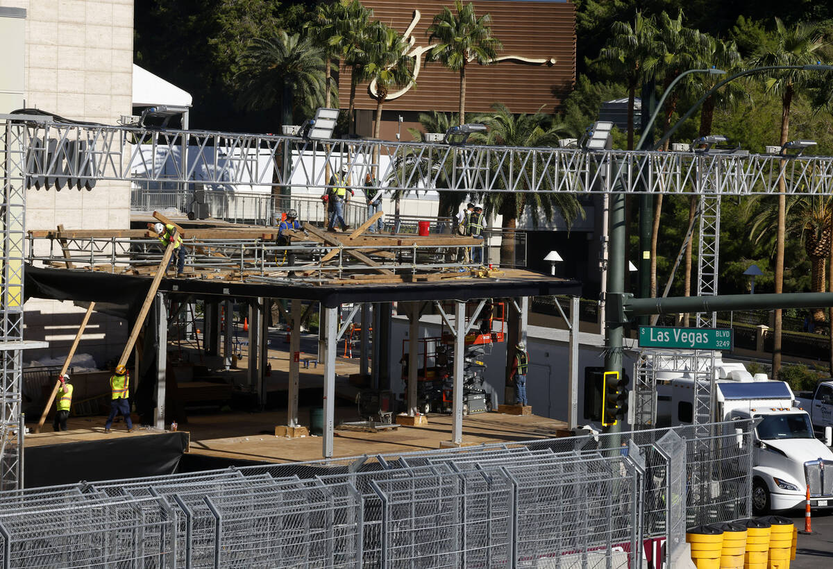 Workers are in the process of dismantling the Formula 1 Grand Prix viewing stages in front of W ...