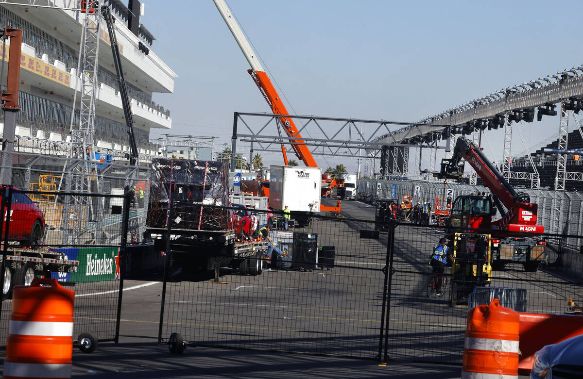 Workers are in the process of dismantling the Formula 1 Grand Prix grandstands on Monday, Nov. ...