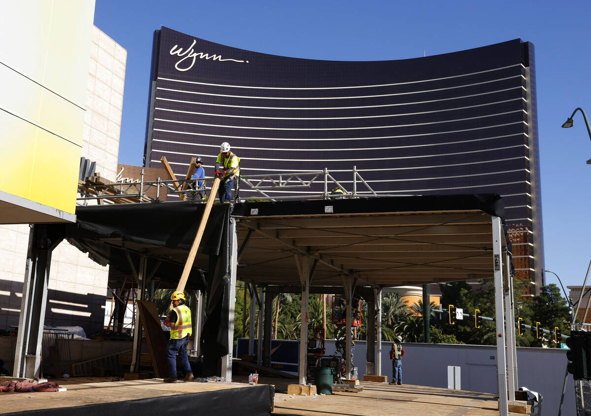 Workers are in the process of dismantling the Formula 1 Grand Prix viewing stages in front of W ...