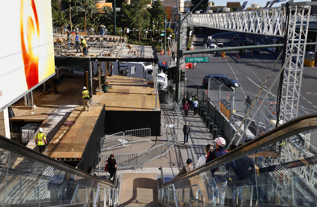 Workers are in the process of dismantling the Formula 1 Grand Prix viewing stages in front of W ...