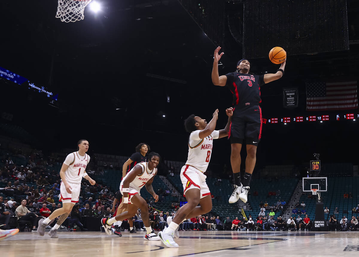 UNLV guard Howie Fleming Jr. (3) grabs a rebound against Maryland Terrapins guard David Coit (8 ...