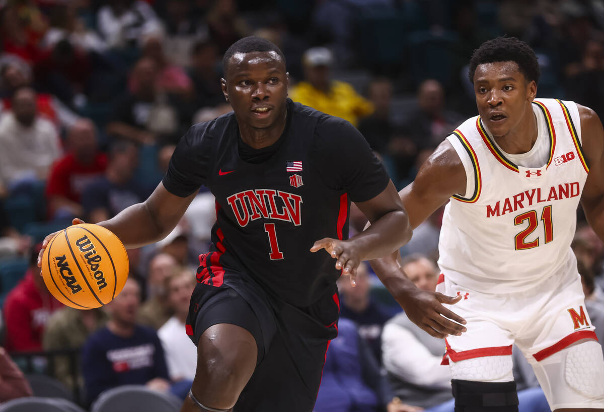 UNLV forward Ladji Dembele (1) drives to the basket past Maryland Terrapins forward Pharrel Pay ...