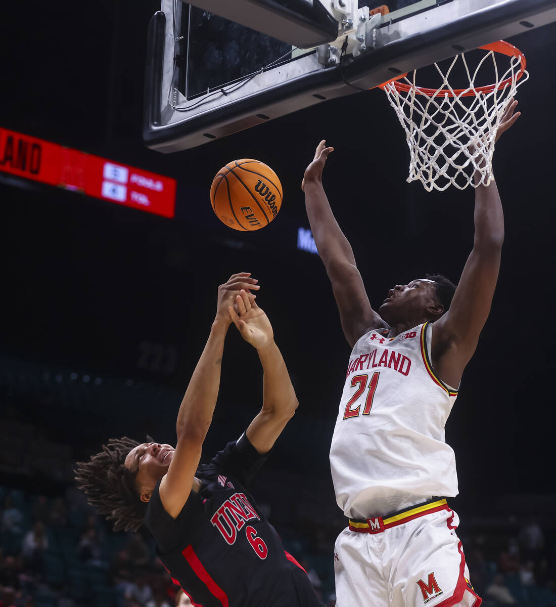 Maryland Terrapins forward Pharrel Payne (21) blocks the shot of UNLV forward Tyrin Jones (6) d ...