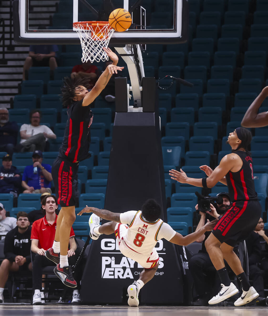 UNLV forward Tyrin Jones (6) blocks the shot of Maryland Terrapins guard David Coit (8) during ...