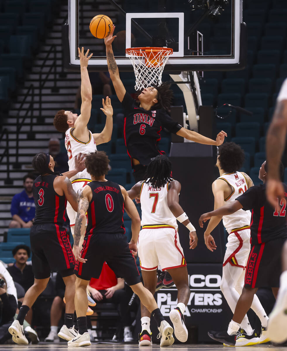 UNLV forward Tyrin Jones (6) blocks the shot of Maryland Terrapins forward Elijah Saunders (13) ...