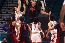 UNLV forward Tyrin Jones (6) blocks the shot of Maryland Terrapins forward Elijah Saunders (13) ...