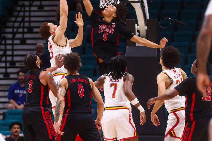 UNLV forward Tyrin Jones (6) blocks the shot of Maryland Terrapins forward Elijah Saunders (13) ...