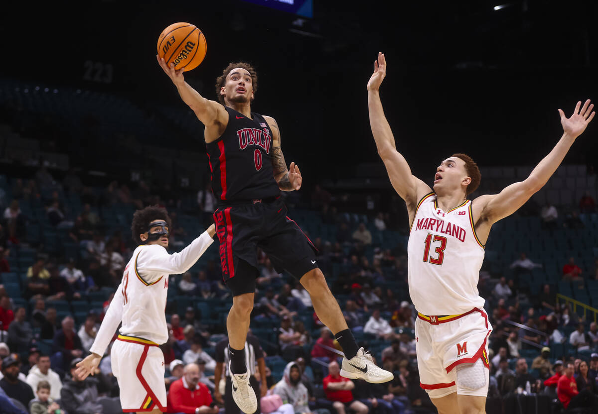 UNLV guard Dravyn Gibbs-Lawhorn (0) lays up the ball past Maryland Terrapins forward Elijah Sau ...