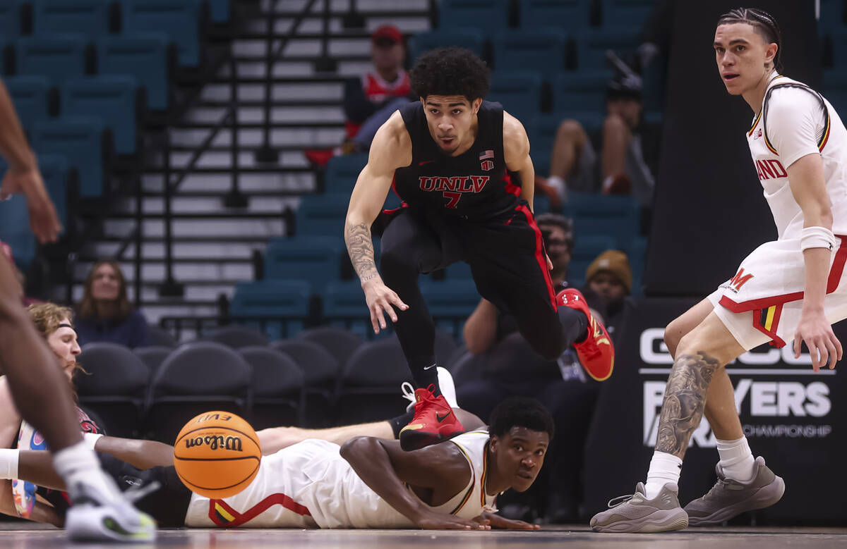 UNLV guard Al Green (7) jumps over Maryland Terrapins forward Pharrel Payne (21) for a loose ba ...