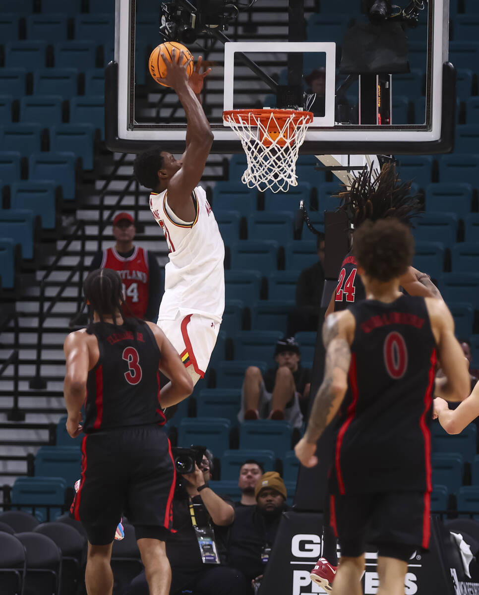 Maryland Terrapins forward Pharrel Payne (21) dunks the ball against UNLV during the second hal ...
