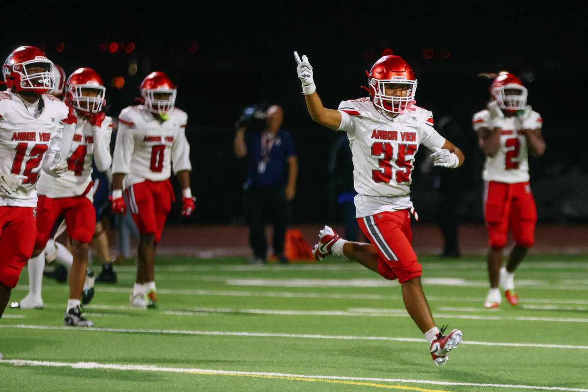 Arbor View cornerback Michael Miniano (35) celebrates making an interception during the open di ...