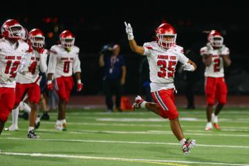Arbor View cornerback Michael Miniano (35) celebrates making an interception during the open di ...