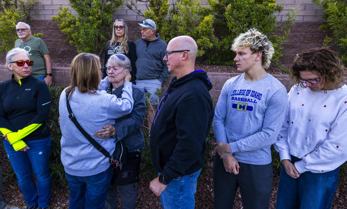 Crystal Probst offers her condolences to Linda Sterner during a Ghost Bike ceremony in honor of ...