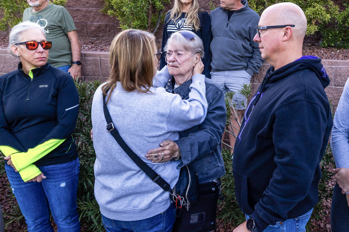 Crystal Probst offers her condolences to Linda Sterner during a Ghost Bike ceremony in honor of ...
