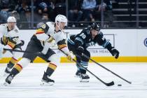 Utah Mammoth defenseman Nate Schmidt (88) defends Vegas Golden Knights right wing Pavel Dorofey ...