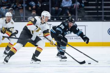Utah Mammoth defenseman Nate Schmidt (88) defends Vegas Golden Knights right wing Pavel Dorofey ...