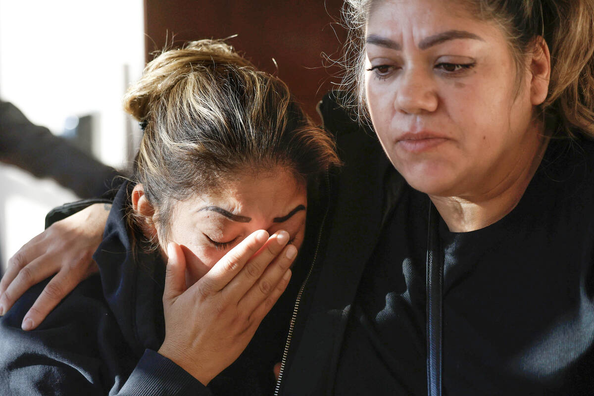Gabriela Rincon, left, the mother of a crash victim Adilene Duran Rincon, 20, is comforted by a ...