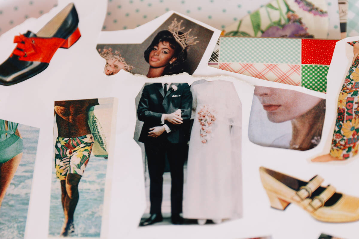 Cutouts and scraps of paper sit in a pile during a junk journaling meet-up at Shop Mama Sage in ...