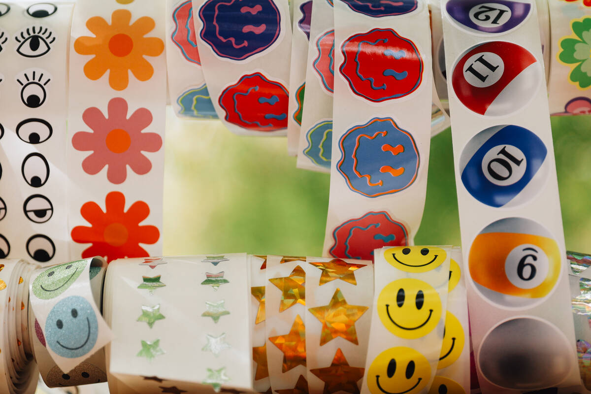 Stickers sit out during a junk journaling meet-up at Shop Mama Sage in Container Park on Saturd ...