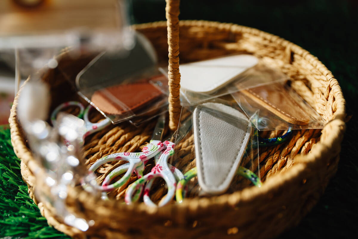 Scissors sit in a basket during a junk journaling meet-up at Shop Mama Sage in Container Park S ...