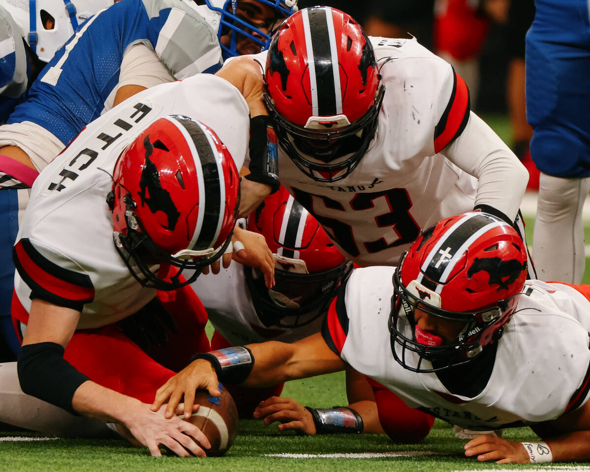 Pershing County linebacker Jordan Fitch (8), tackle Jordan Elerick (63), and defensive end Asht ...