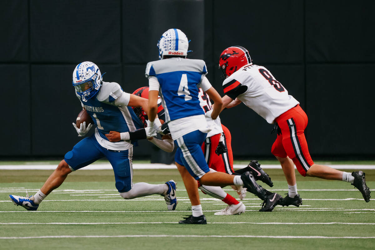 Pershing County defenders pursue Needles wide receiver Robert Tapia (1) during the second half ...