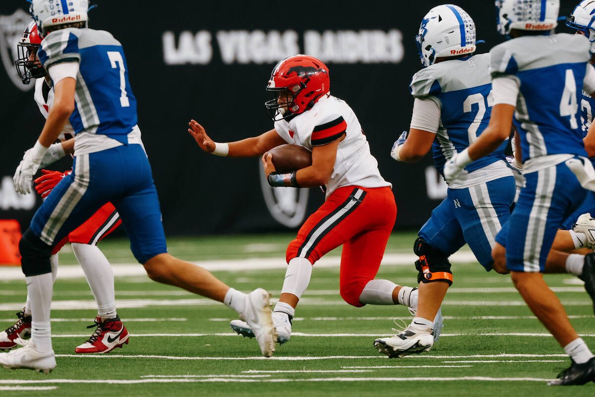 Pershing County running back Trenton Rhodes (4) weaves in between Needles players during the se ...