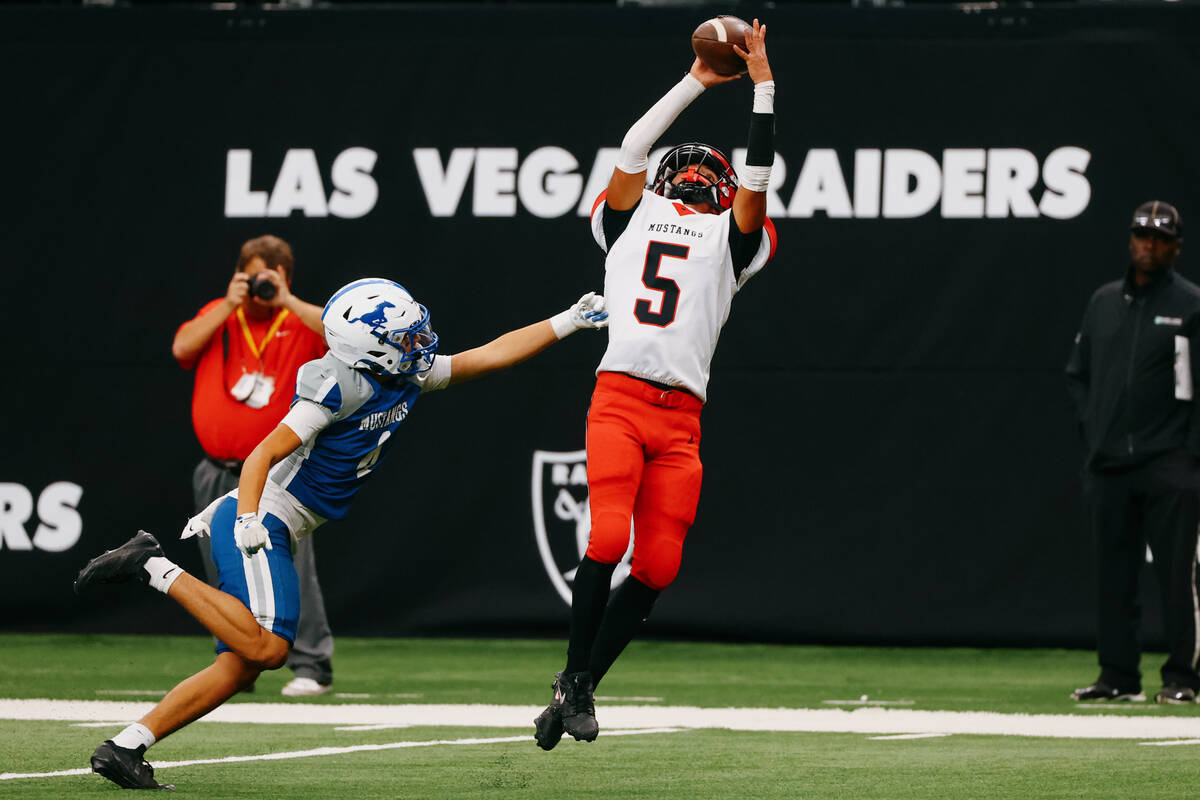 Pershing County wide receiver Ramon Sanchez (5) makes a reception that turned into a touchdown ...
