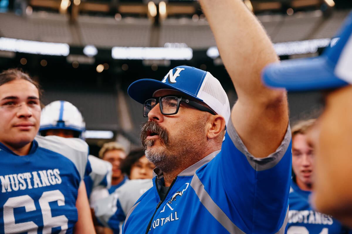 Needles head coach Thomas DeLeon talks with his team after winning the 2A state championship ga ...