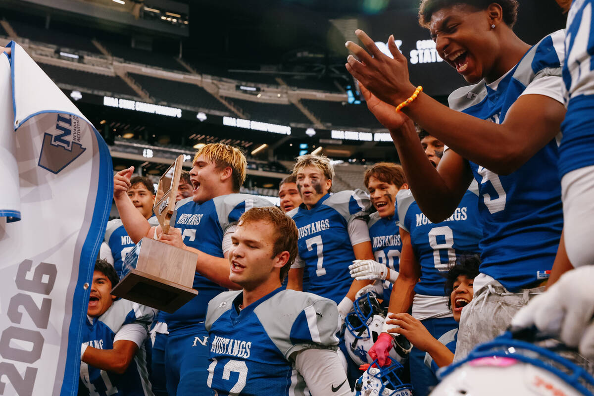 Needles players celebrate winning the 2A state championship game on Tuesday, Nov. 25, 2025 at A ...
