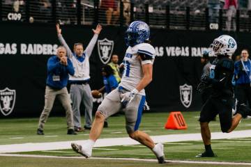 McQueen tight end Brooks Porter (11) runs in for a touchdown during first half of the 4A State ...