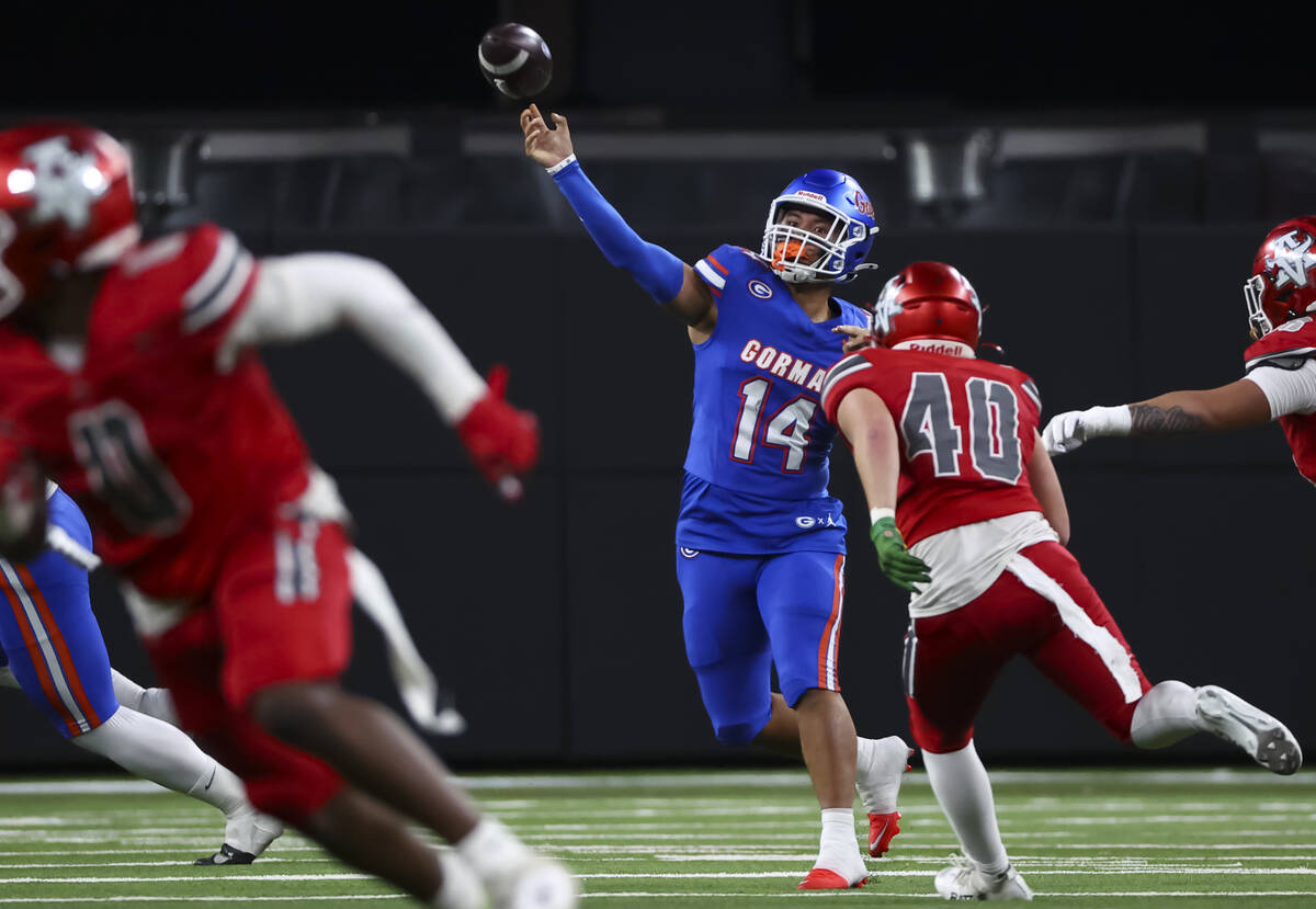 Bishop Gorman quarterback Maika Eugenio (14) throws a pass under pressure from Arbor View&#x201 ...