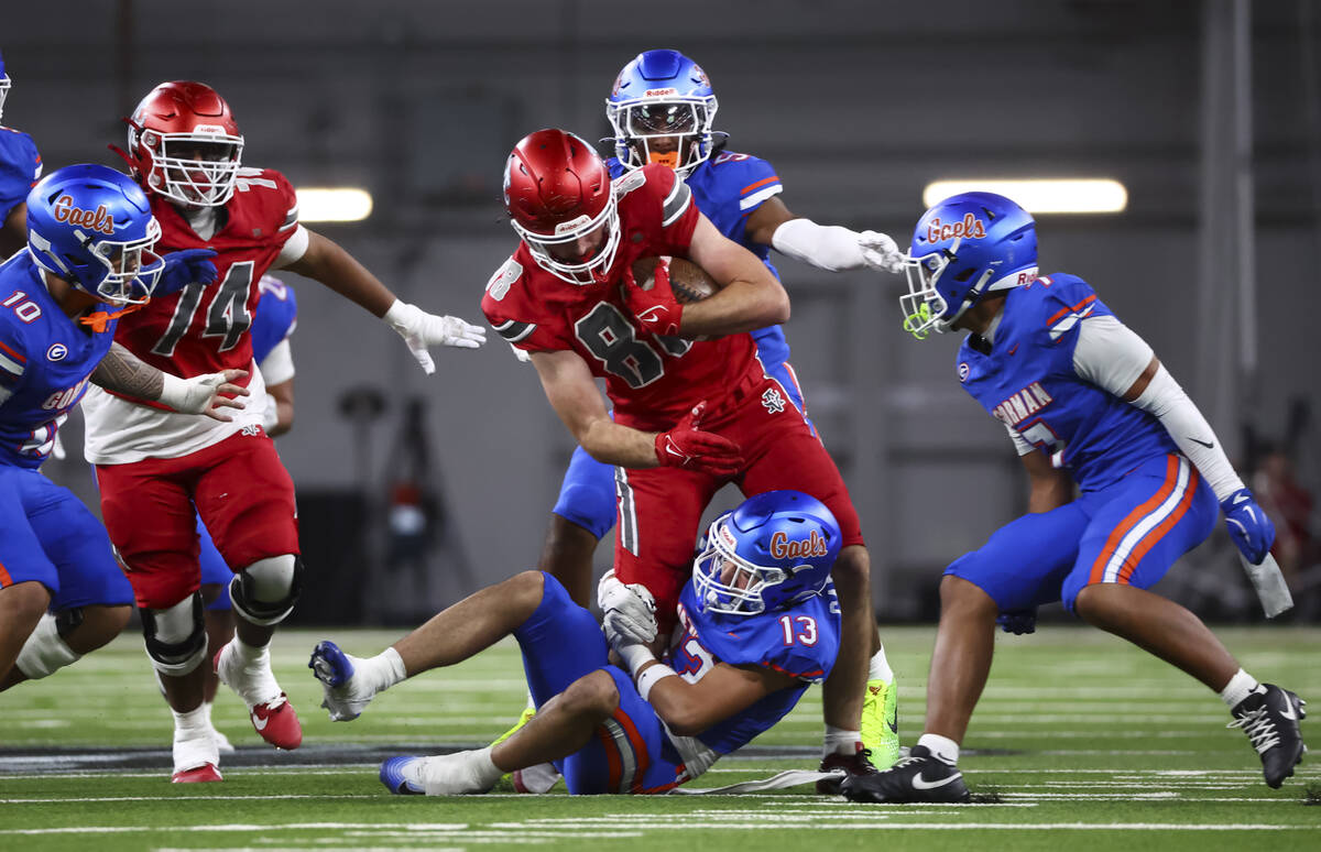 Arbor View’s Zac Fares (88) gets taken down by Bishop Gorman defensive back Darian Abell ...