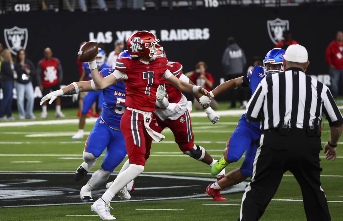 Arbor View quarterback Thaddeus Thatcher (7) throws the ball under pressure from Bishop Gorman ...