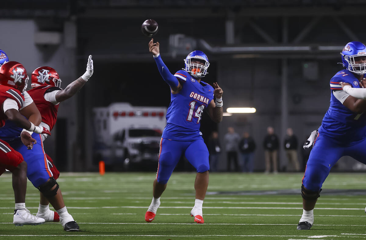 Bishop Gorman quarterback Maika Eugenio (14) throws a pass during first half of the Open Divisi ...