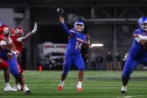 Bishop Gorman quarterback Maika Eugenio (14) throws a pass during first half of the Open Divisi ...