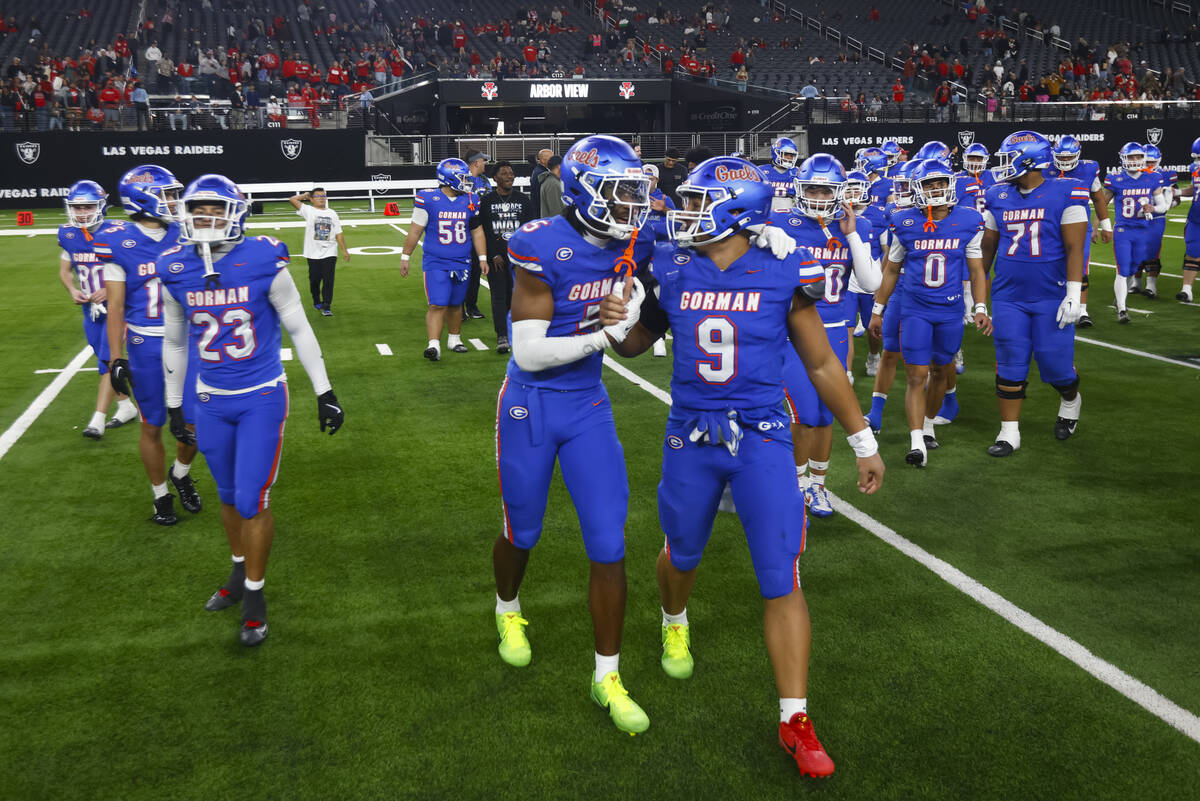 Bishop Gorman players celebrate after defeating Arbor View to win the Open Division NIAA state ...
