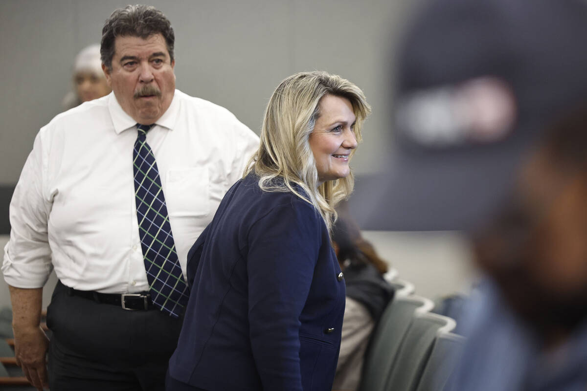 Henderson Councilwoman Carrie Cox, middle, appears at her arraignment hearing at the Regional J ...