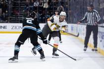 Vegas Golden Knights defenseman Noah Hanifin (15) passes the puck past Utah Mammoth defenseman ...