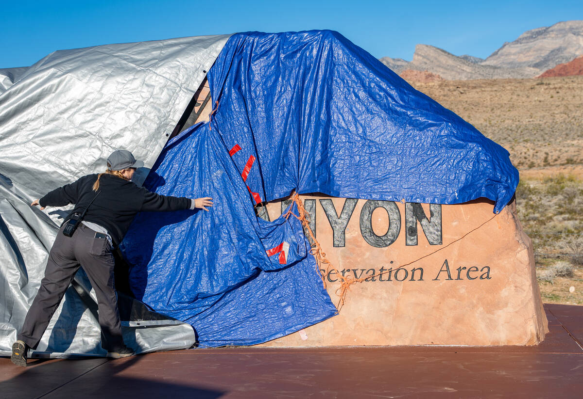 The relocated Red Rock Canyon sign is revealed during the opening of an accompanying parking lo ...