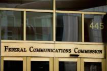 The entrance to the Federal Communications Commission building in Washington. (AP Photo/Andrew ...