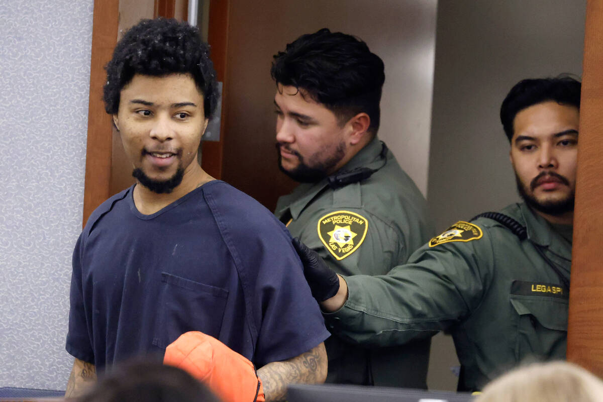 Stanley Weaver, who pleaded guilty to stalking Gov. Joe Lombardo and his family, is led into a ...