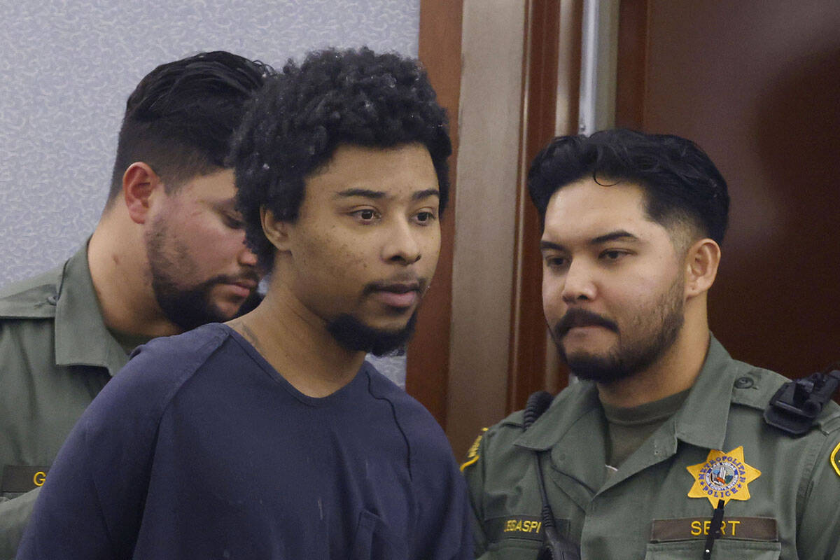 Stanley Weaver, who pleaded guilty to stalking Gov. Joe Lombardo and his family, is led out of ...