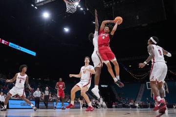 UNLV forward Tyrin Jones (6) drives to the basket against Alabama forward London Jemison (6) du ...