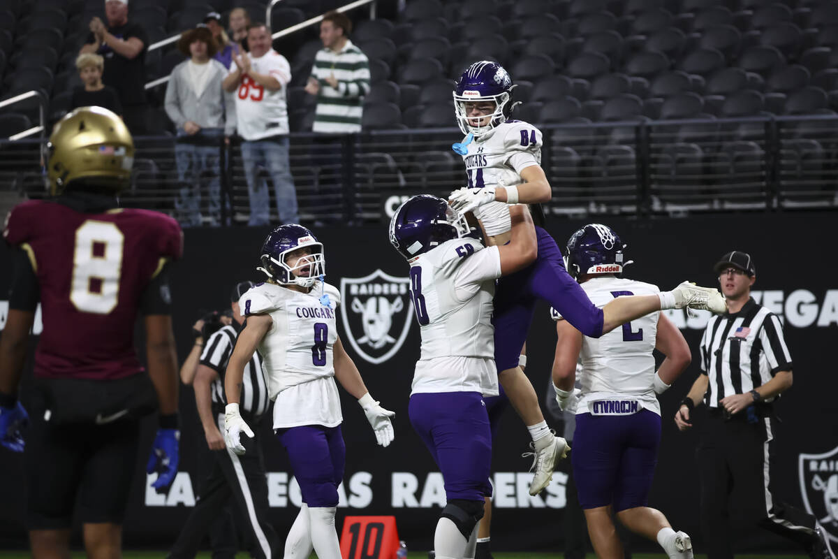 Spanish Springs wide receiver Jackson Sundeen (84) celebrates his touchdown with Elijah Gustavs ...