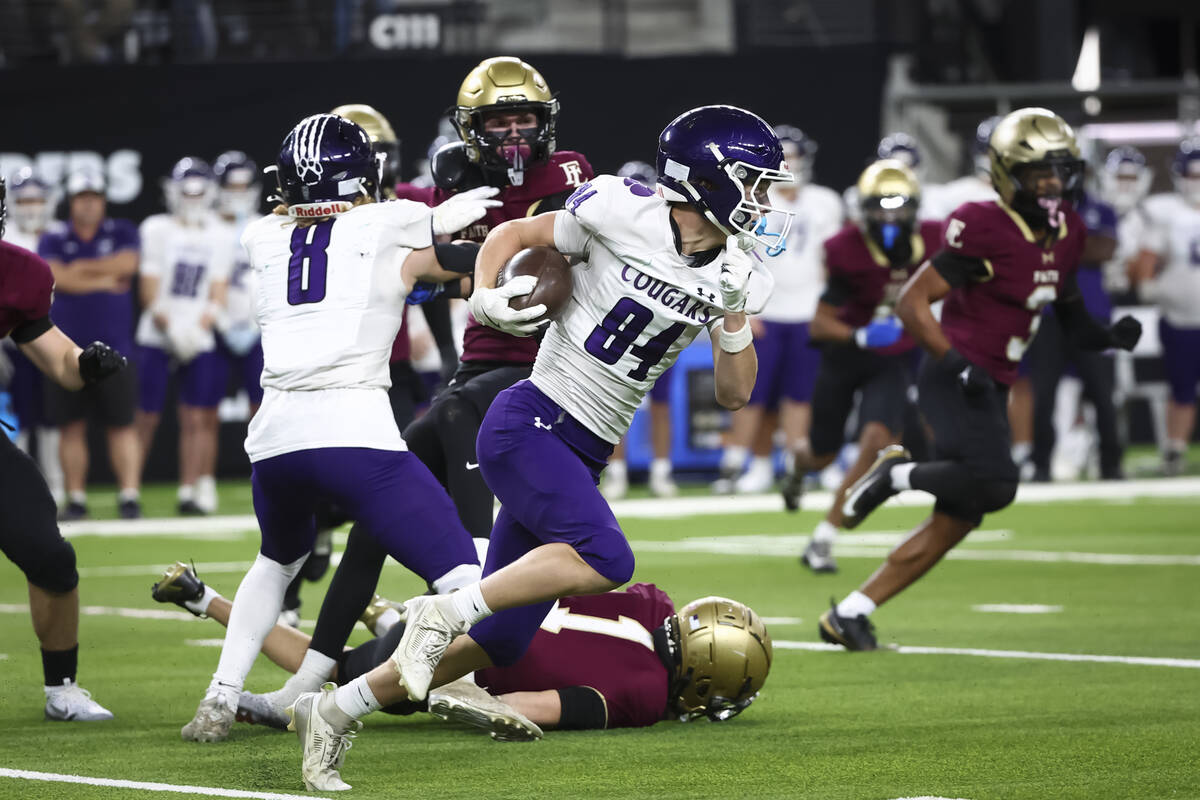 Spanish Springs wide receiver Jackson Sundeen (84) runs the ball against Faith Lutheran during ...