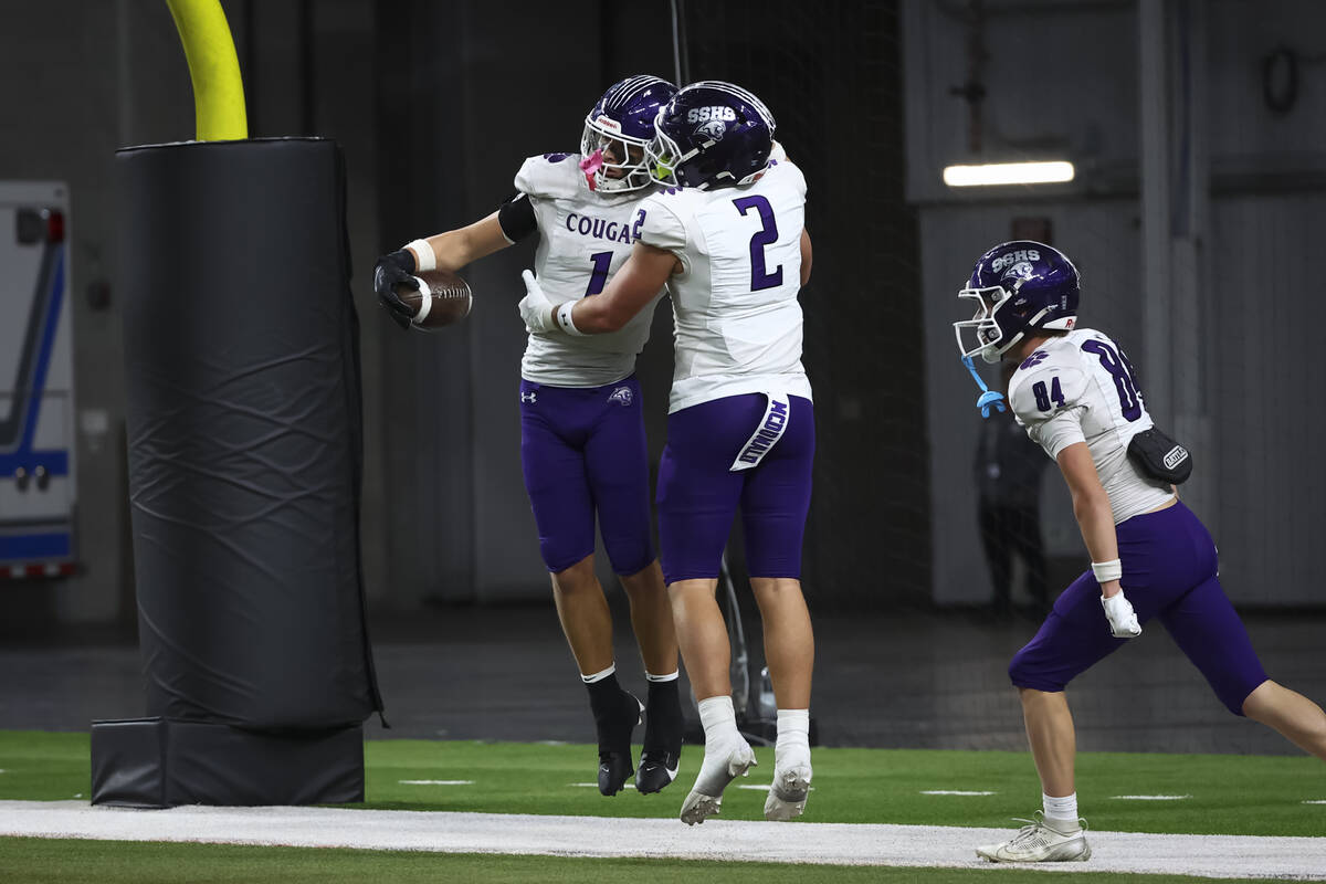 Spanish Springs’ Brady Hummel (1) celebrates his touchdown against Faith Lutheran during ...