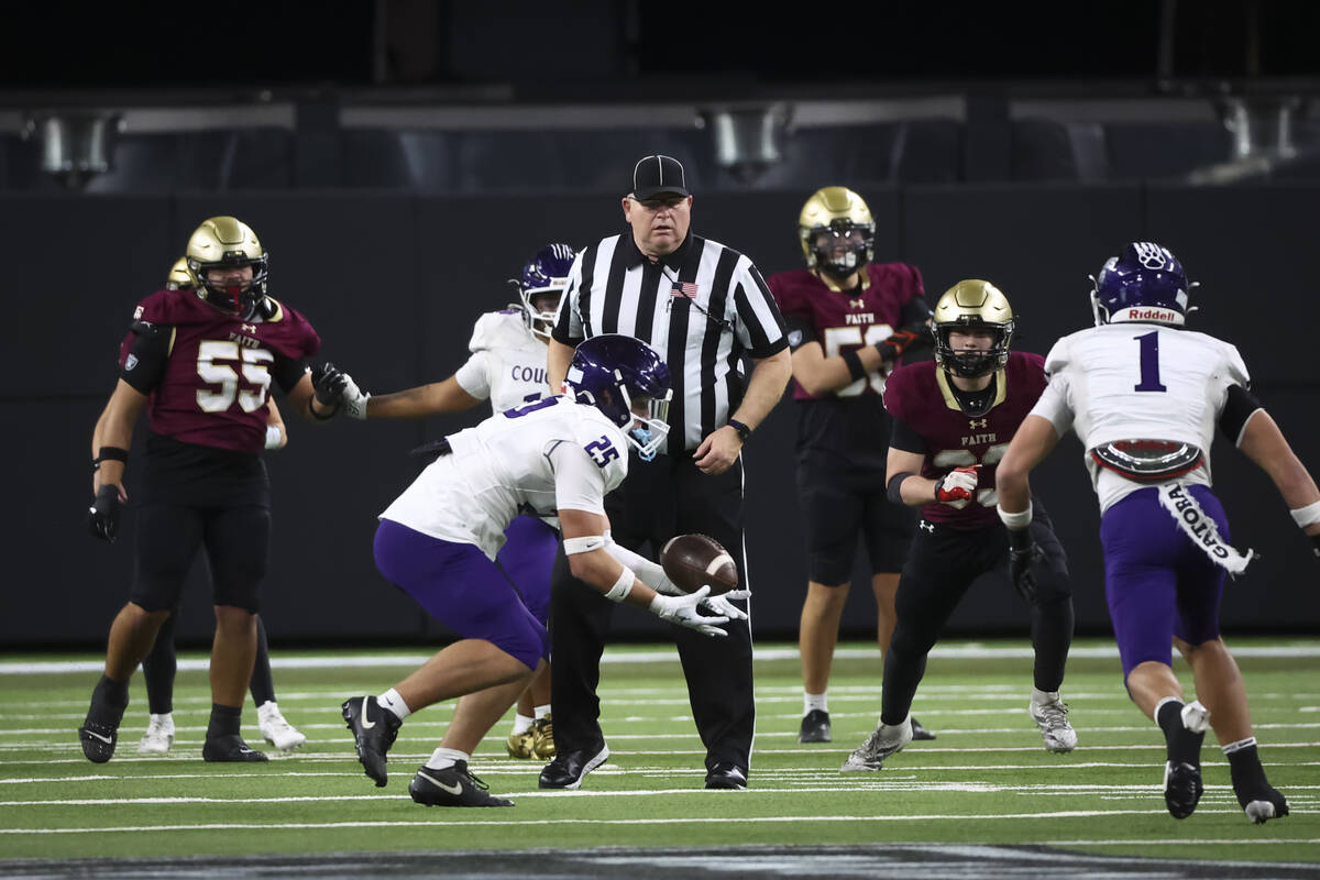 Spanish Springs middle linebacker Matthew Zahradka (25) intercepts the ball from Faith Lutheran ...