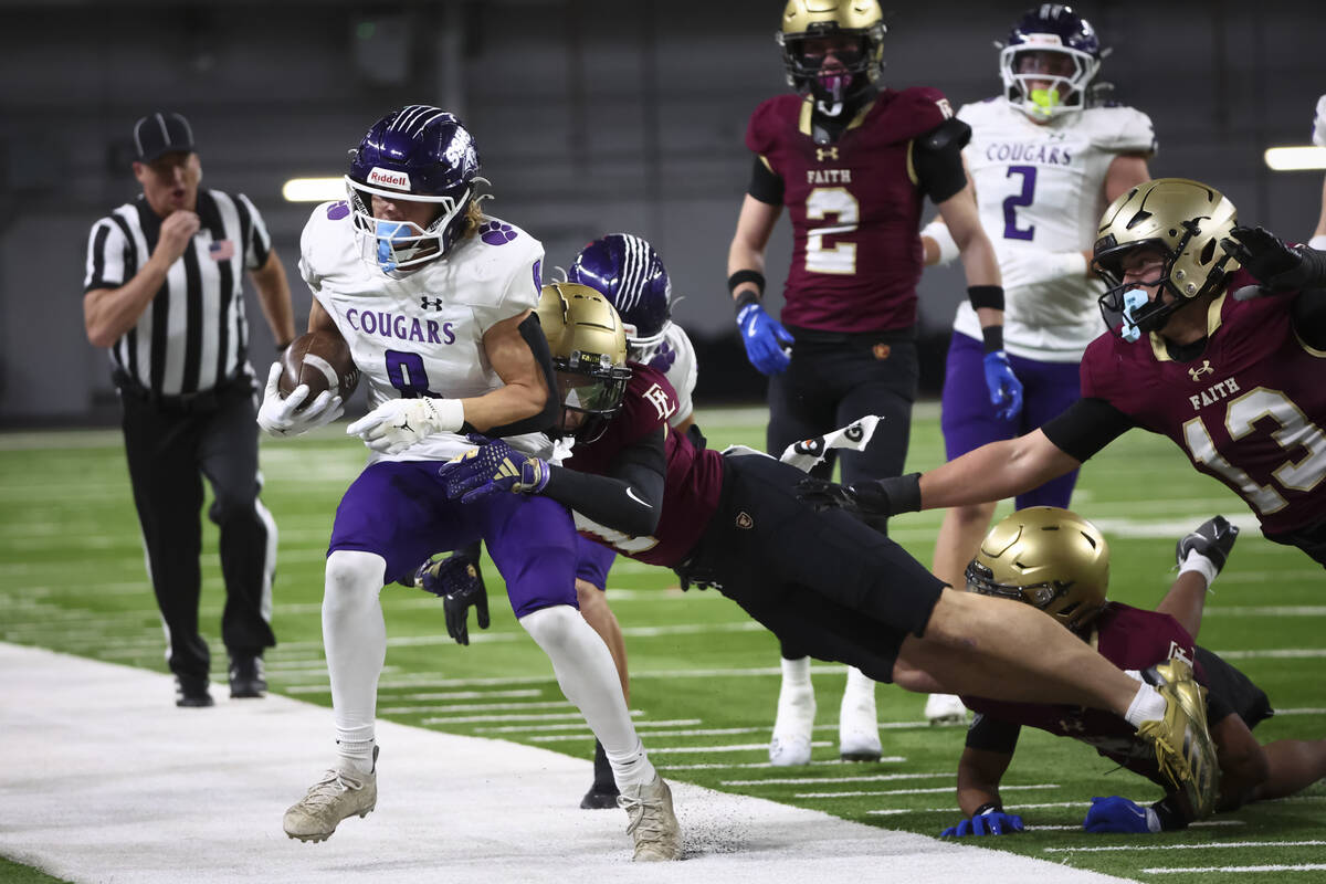 Spanish Springs’ Cooper Milligan (8) gets forced out of bounds by Faith Lutheran defensi ...