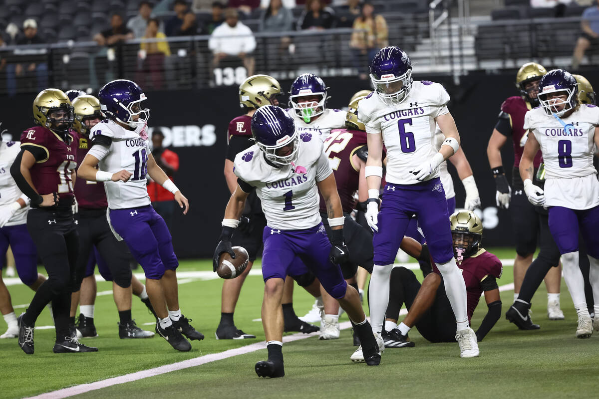 Spanish Springs’ Brady Hummel (1) reacts after scoring a touchdown against Faith Luthera ...